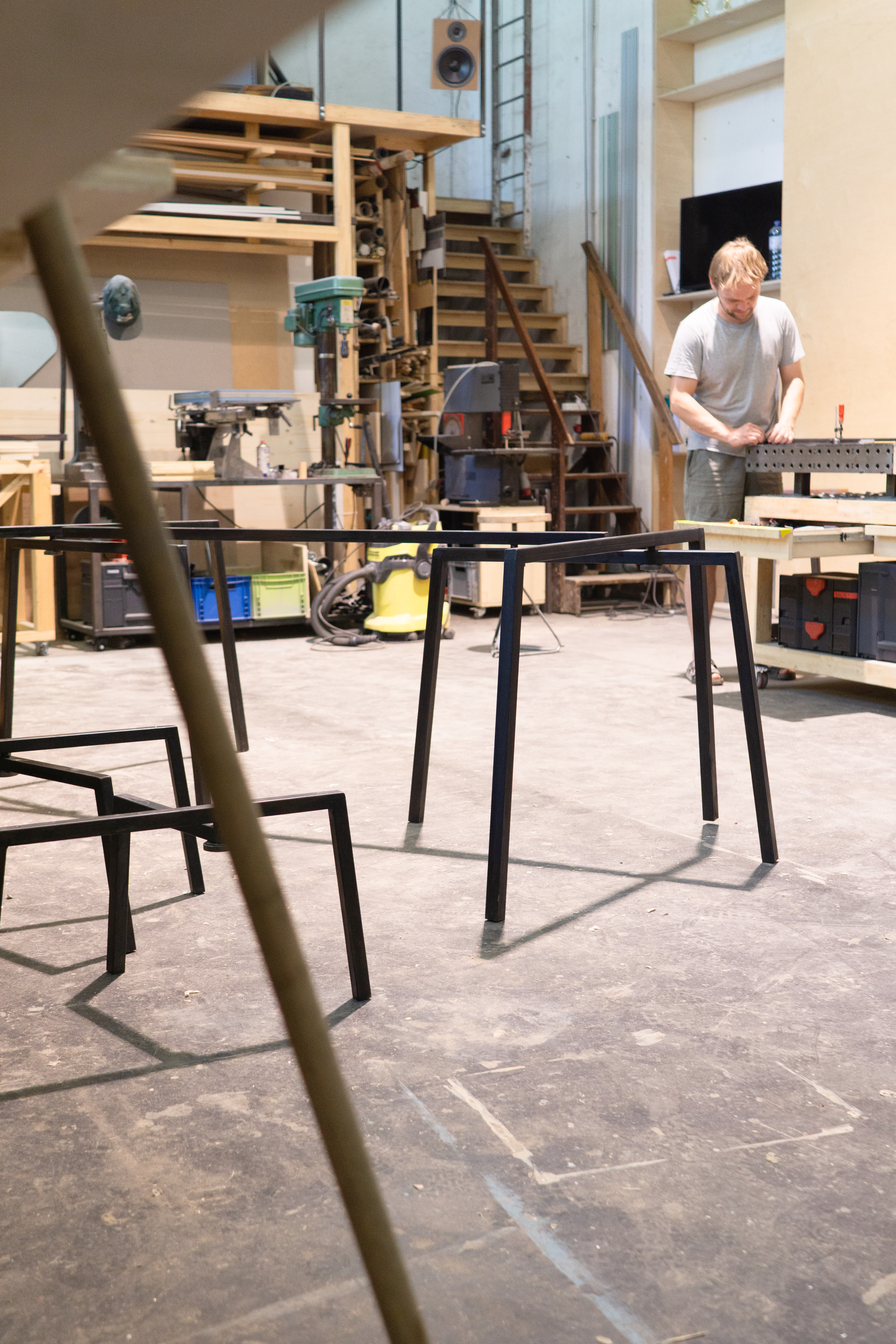 Photo from Lucas Schmid working at his metal and wood workshop